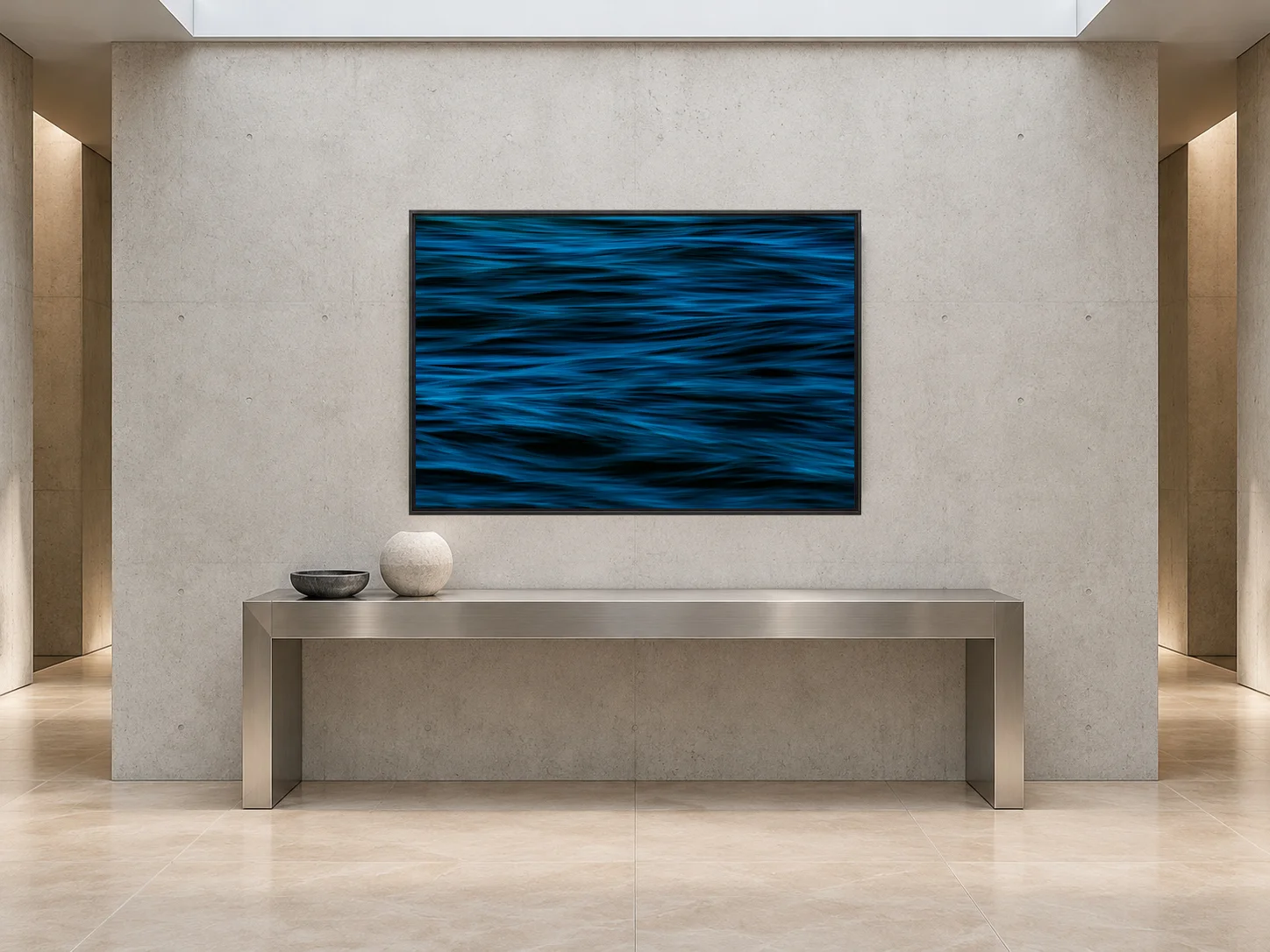 Illustrative interior mockup: original Blue Cadence photograph in a charcoal frame above a steel console in a concrete entrance corridor.