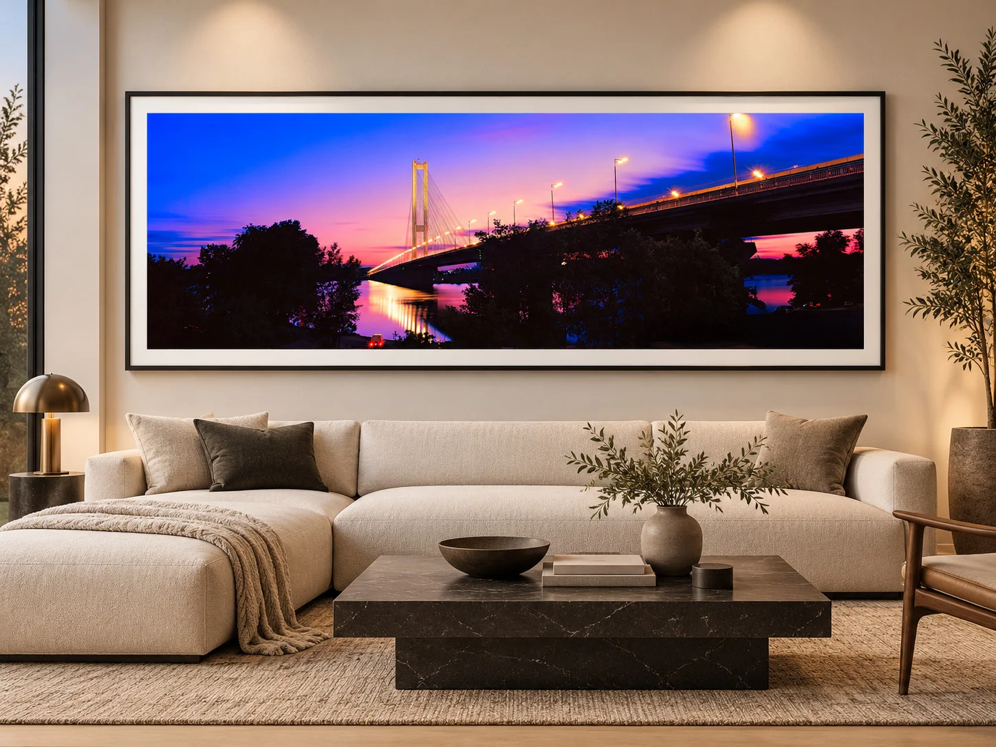 Afterglow panoramic fine art photograph of Kyiv and a bridge over the Dnipro at twilight, displayed as a large-format print in a contemporary interior.